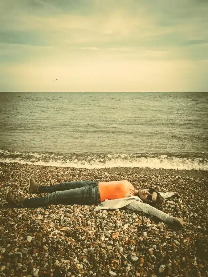 woman lying on beach
