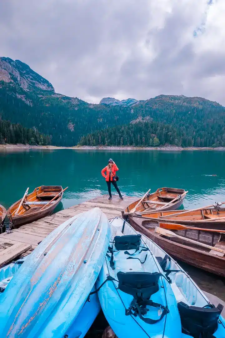 Lady at Durmitor National Park Black Lake with boats