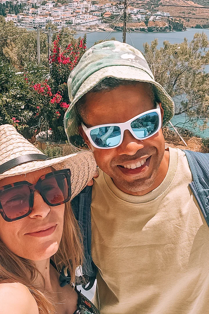 man and woman with batsi in background