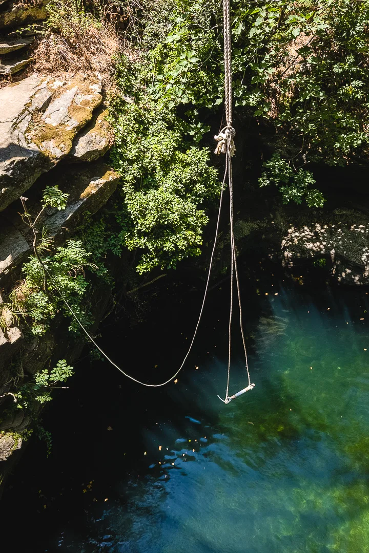 rope swing over Gerolimni lake pool