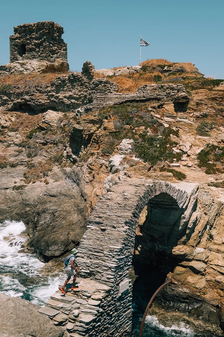 chora castle bridge with man running up