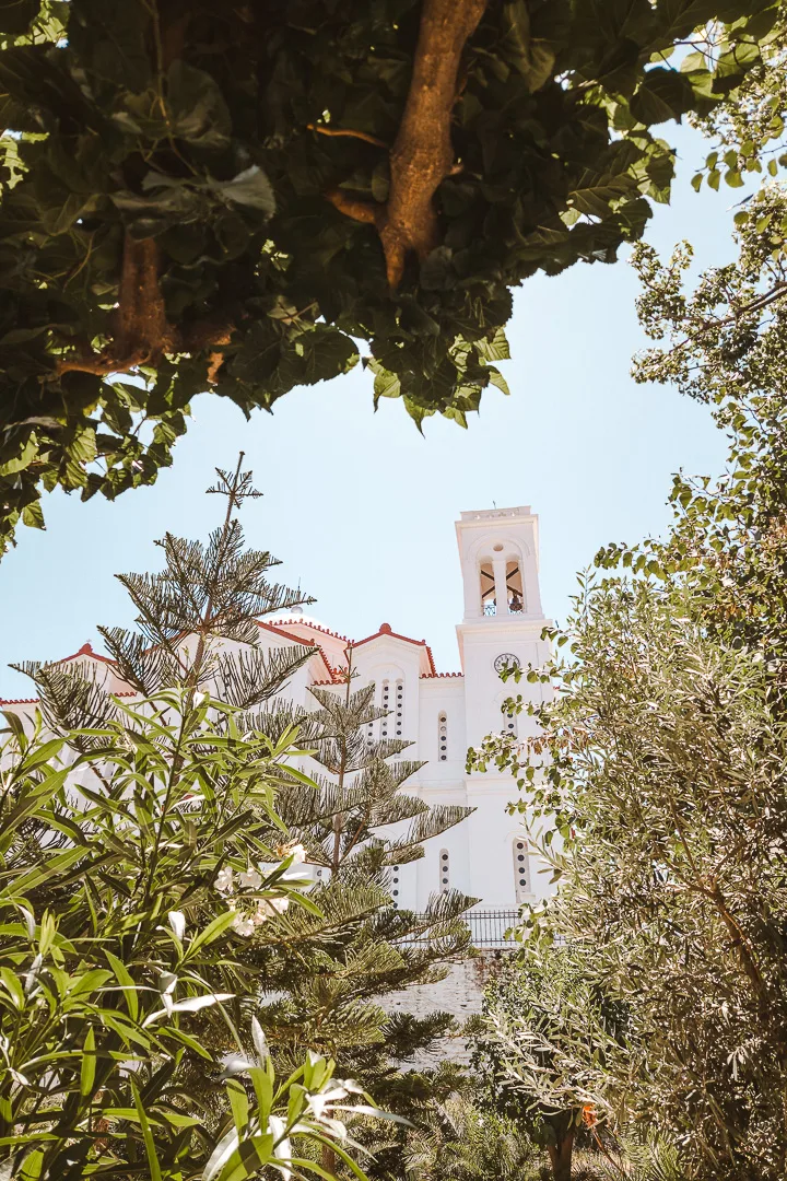 church in chora seen through trees